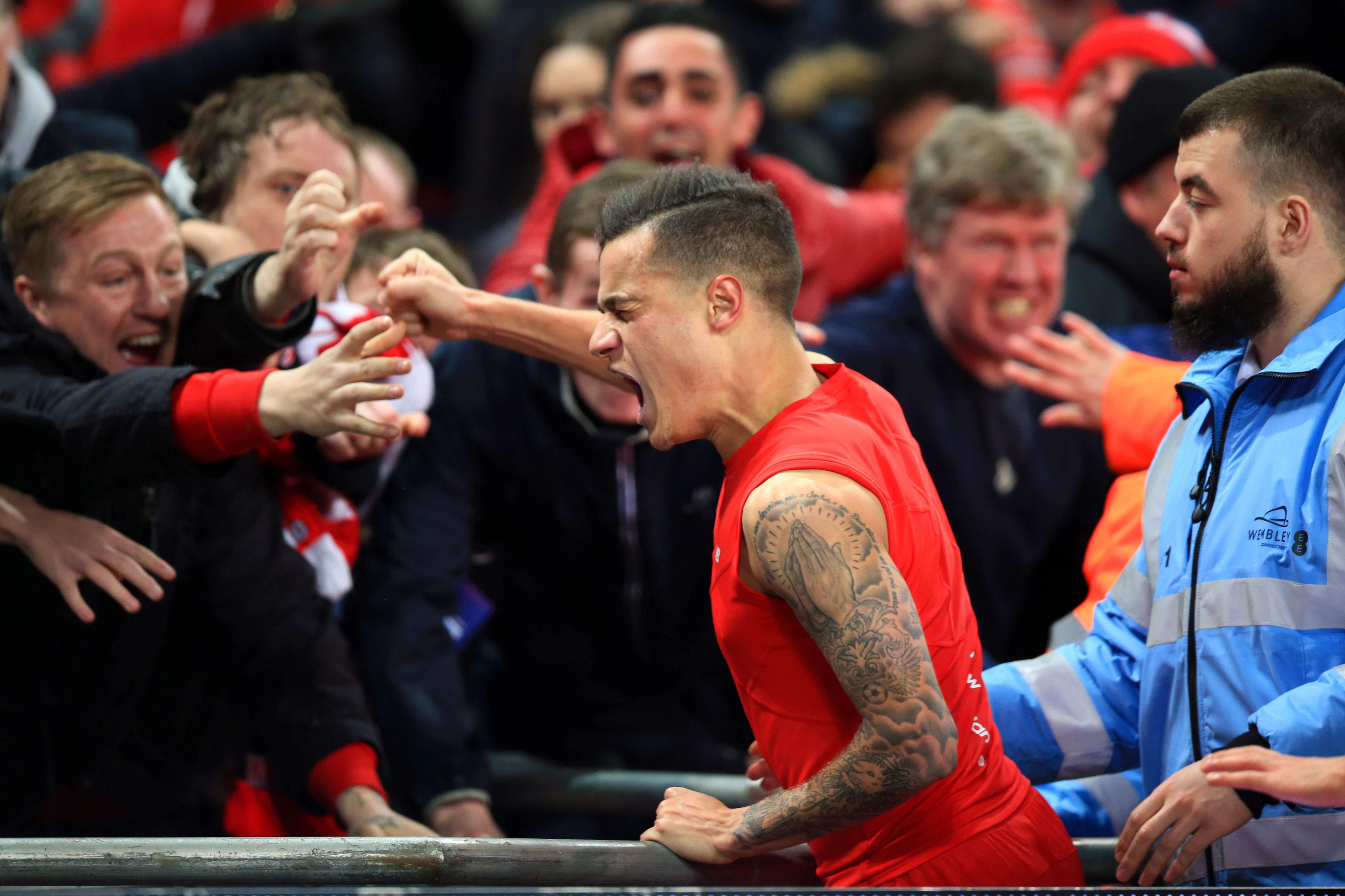 Liverpool's Philippe Coutinho celebrates scoring their first goal of the game with the Liverpool fans during the Capital One Cup Final match between Liverpool and Manchester City played at Wembley Stadium, London Egerton / PA Images / Icon Sport *** Local Caption ***