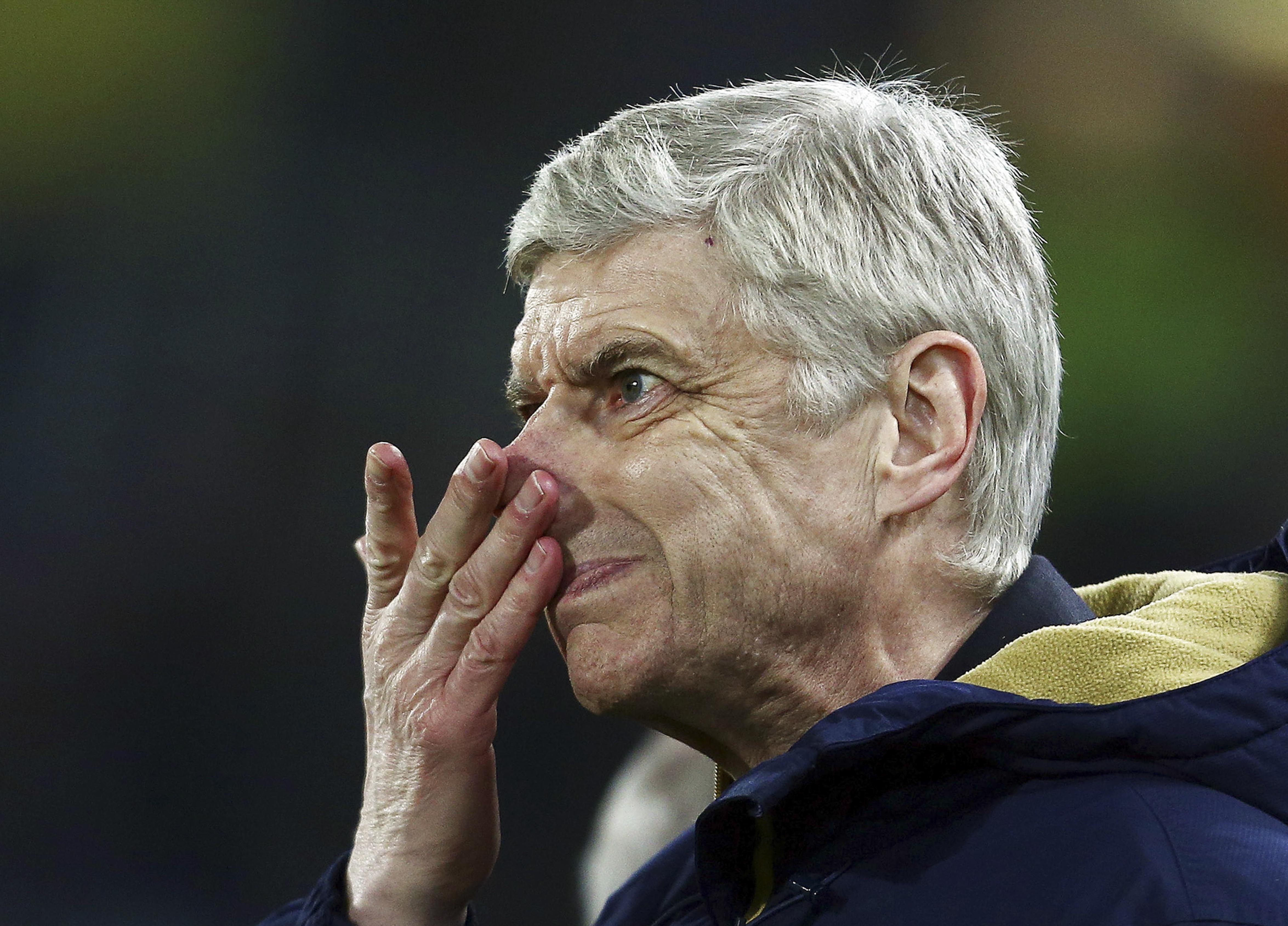 Arsenal manager Arsene Wenger wipes his nose during the Emirates FA Cup fifth round replay match between Hull City and Arsenal played at the Kingston Communications Stadium, Hull on March 8th 2016 West / Bpi / Icon Sport *** Local Caption ***