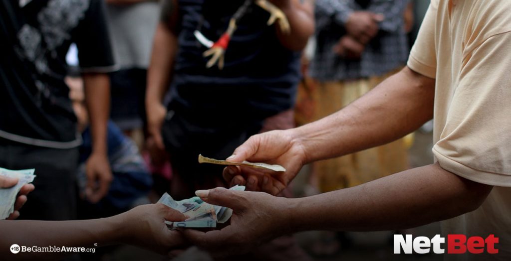 Men handling money in a casino