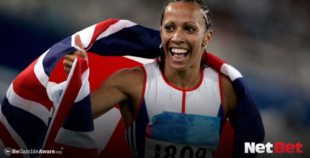 Dame Kelly Holmes wrapped in British flag