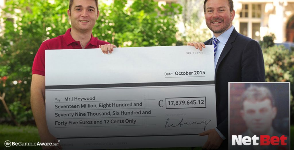 Jon Heywood holds a cheque for his winnings