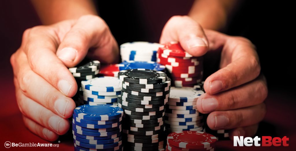 hands and casino chips NetBet why we do we use casino chips